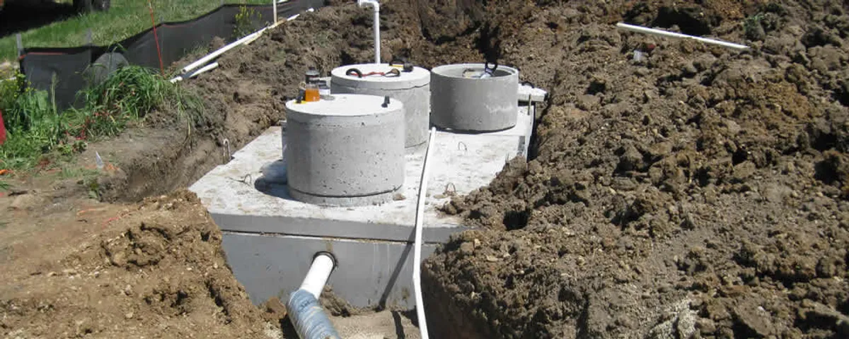 Septic system repair and installation site with tank access ports in Virginia Beach, VA